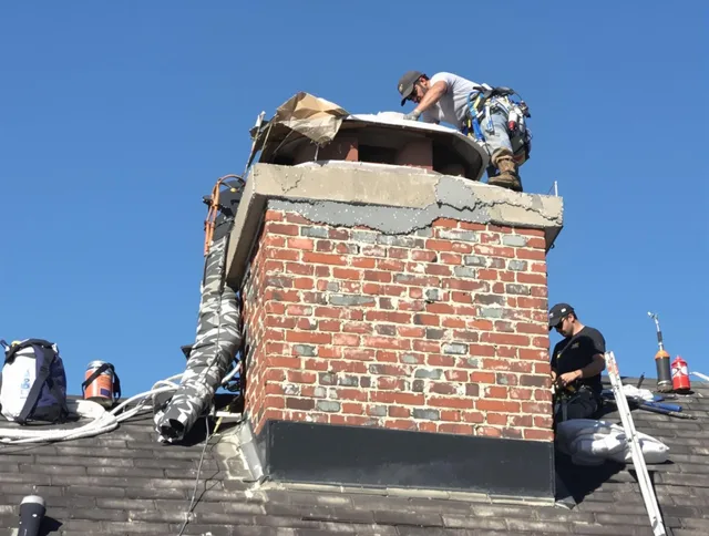 Pine Hills Chimney Sweep installing a custom chimney crown in Pine Hills, FL