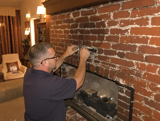 Pine Hills Chimney Sweep expert fixing a fireplace in Pine Hills, FL